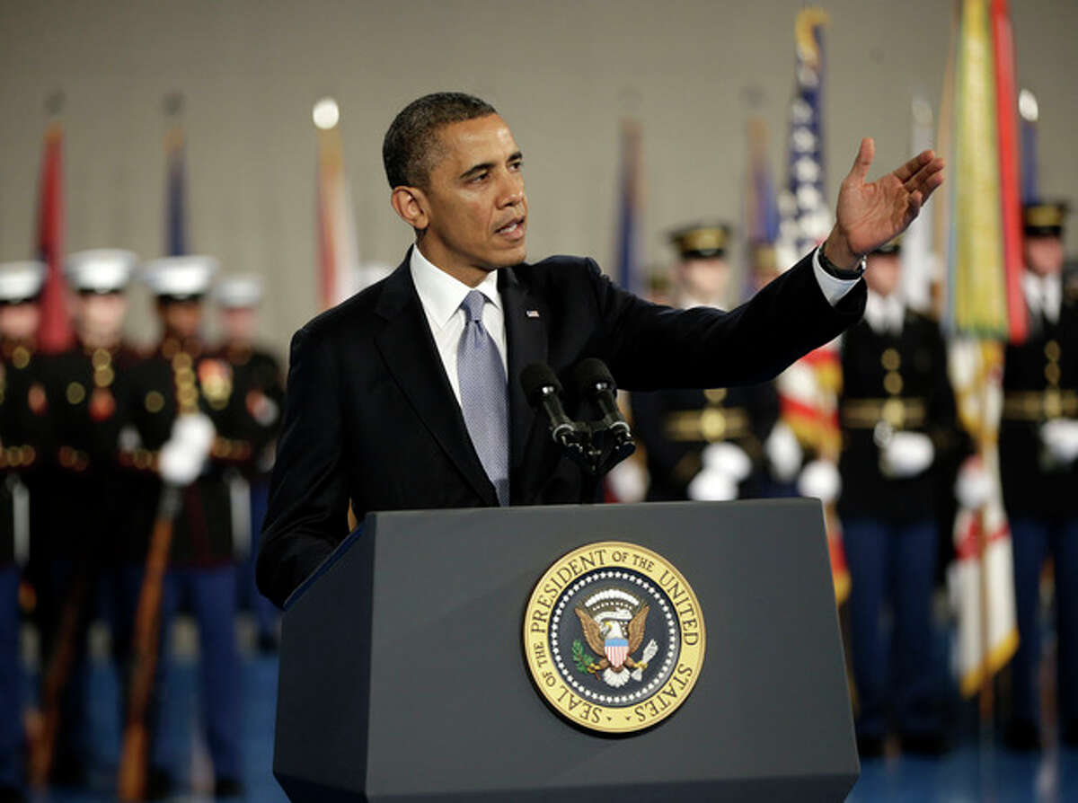 President Barack Obama gestures speaks during an Armed Forces Farewell Ceremony to honor outgoing Defense Secretary Leon Panetta, Friday, Feb. 8, 2013, at Joint Base Myer-Henderson Hall in Arlington, Va. (AP Photo/Pablo Martinez Monsivais)