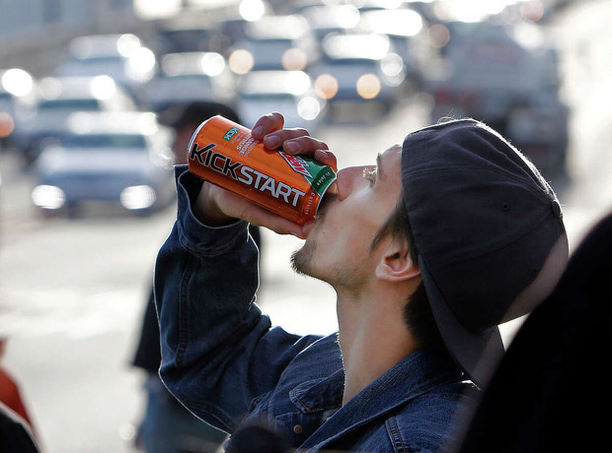 Actor Norbert Torok rehearses as the crew watches during the filming of a commercial for a new PepsiCo product called Kickstart, a carbonated drink that is part juice with Mountain Dew flavor, on the streets of downtown Los Angeles Tuesday, Jan. 29, 2013. PepsiCo Inc. is set to roll out the new drink called Kickstart this month that has Mountain Dew flavor but is made with 5 percent juice and an extra jolt of caffeine and Vitamins B and C. The company is hoping to grow sales by reaching Mountain Dew fans at a new time of day: morning. (AP Photo/Reed Saxon)