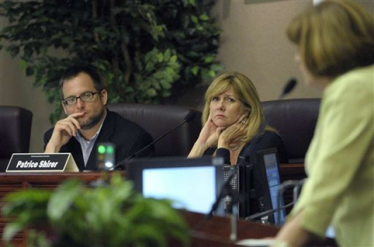 In a April 27, 2011 photo, committee members Jason Searl, left, and Patrice Shirer, center, listen as Zoraida Rios-Andino addresses the group during a meeting of the Orange County Redistricting Advisory Committee in Orlando, Fla. Census data released Thursday, May 5, 2011 show the number of Central and South Americans in Florida grew by more than a half million people. (AP Photo/Phelan M. Ebenhack)