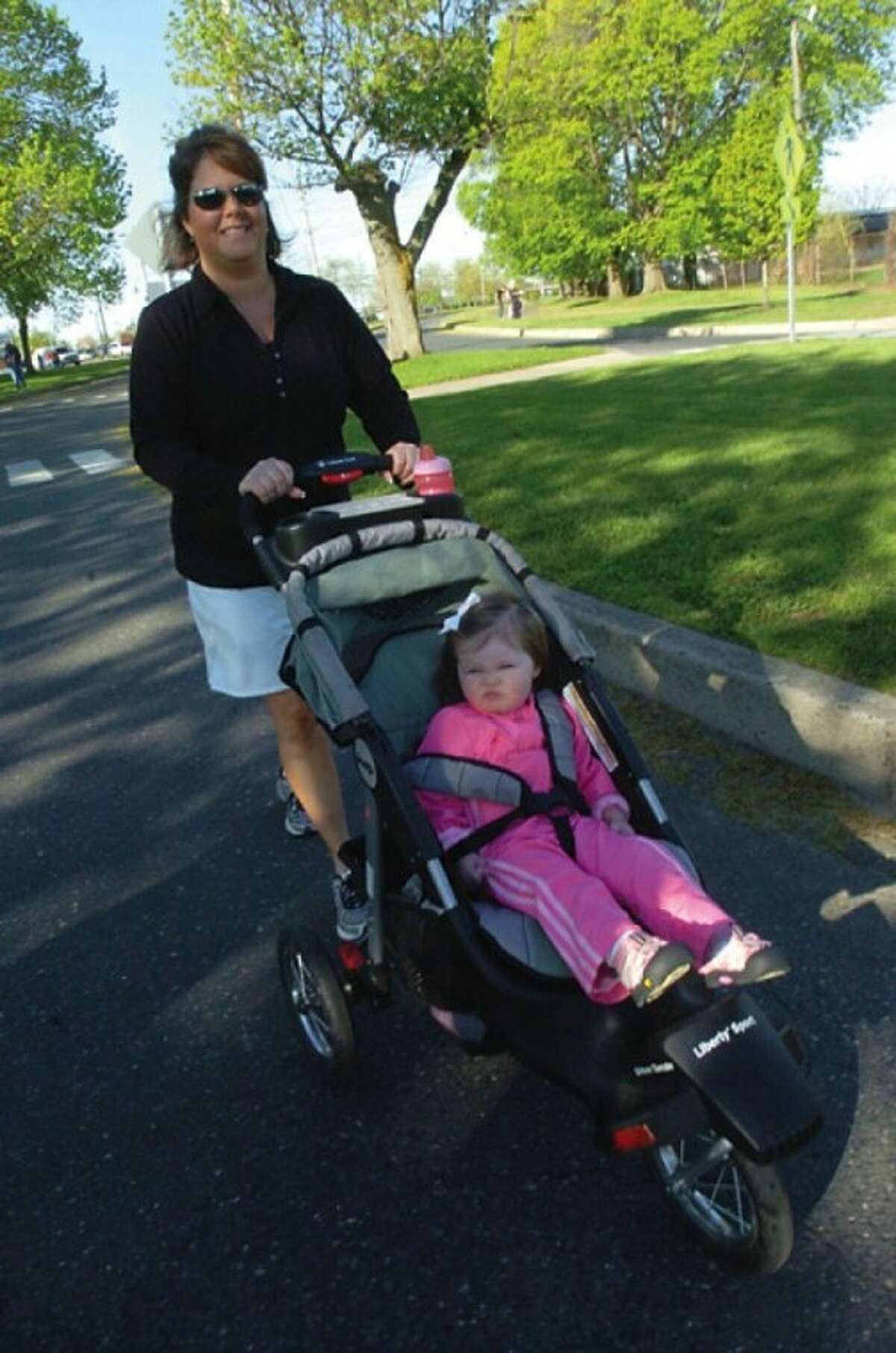 Eileen Donellan- Pinkering with her daughter Jaqueline 2, at the Mother''s Day Road Race Sunday at Calf Pasture Beach. hour photo/matthew vinci