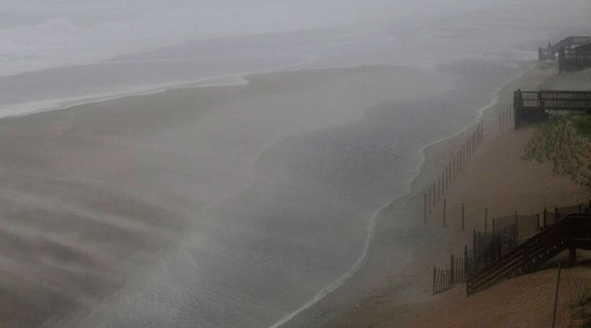 Wind and water whip across the beach as the effects of Hurricane Irene are felt in Nags Head, N.C., Saturday, Aug. 27, 2011 (AP Photo/Gerry Broome)