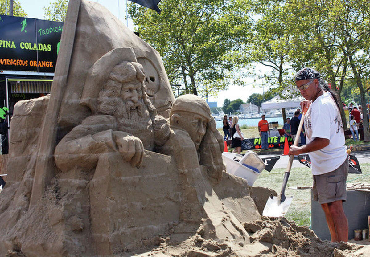 A man works on a pirate sand castle at the Oyster Festival in Norwalk in 2010. Hour Photo / Danielle Robinson