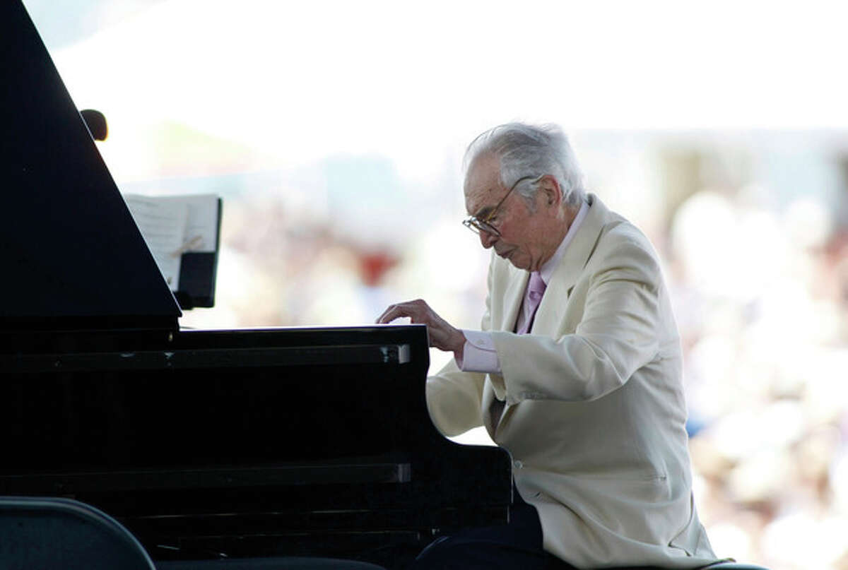 FILE - In this Aug. 8, 2010 file photo, Dave Brubeck plays at the CareFusion Newport Jazz Festival in Newport, R.I. Brubeck is among the featured artists scheduled to return to the festival on Sunday, Aug. 7, 2011. (AP Photo/Joe Giblin, File)