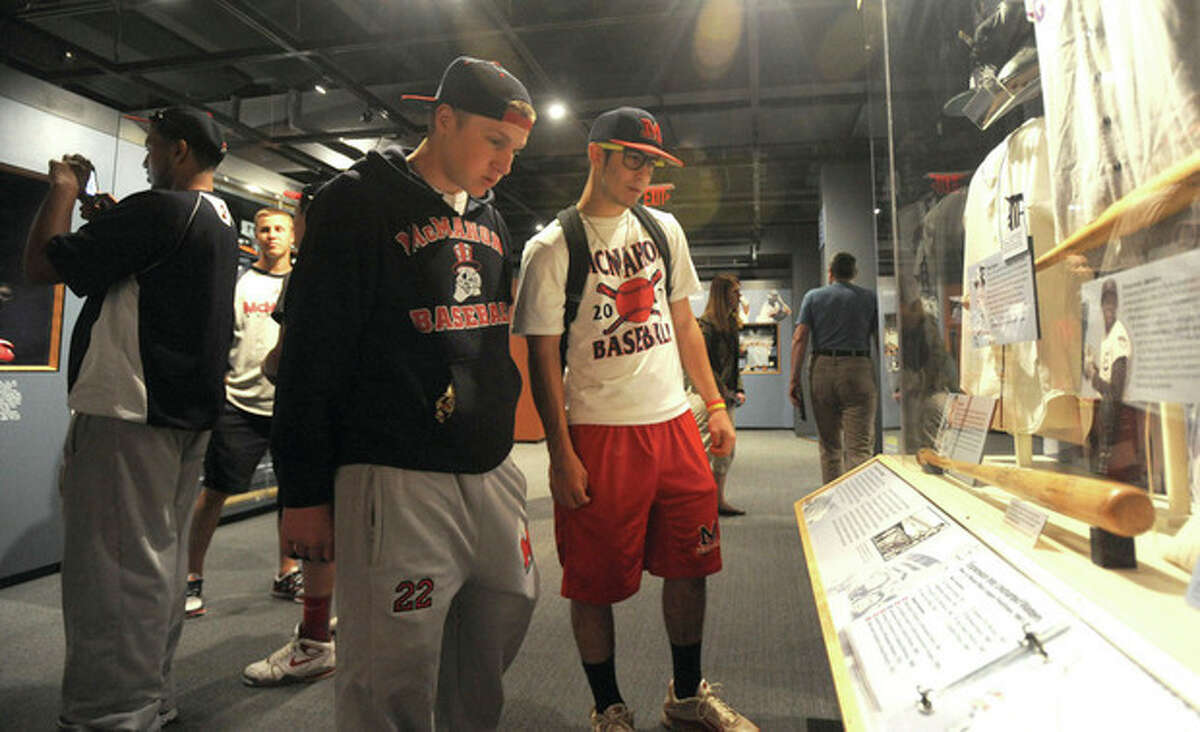 Hour photo/John Nash Brien McMahon baseball players Bryan Daniello, right, and Alex Valenzano take a look at a display at the Baseball Hall of Fame Thursday in Cooperstown, N.Y.