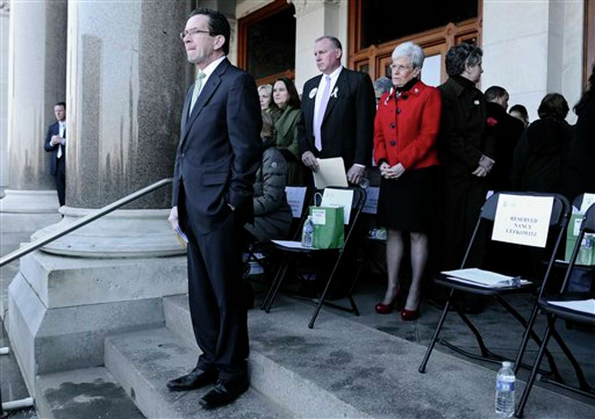 Connecticut Gov. Dannel P. Malloy waits to speak during a rally at the Capitol in Hartford, Conn., Thursday, Feb. 14, 2013. Thousands of people turned out to call on lawmakers to toughen gun laws in light of the December elementary school shooting in Newtown that left 26 students and educators dead. (AP Photo/Jessica Hill)