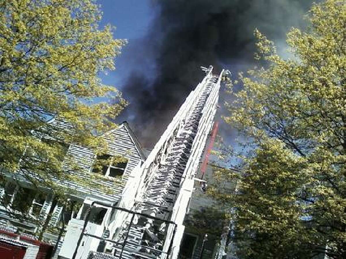Regional fire crews battle a massive blaze in Wilton Sunday.