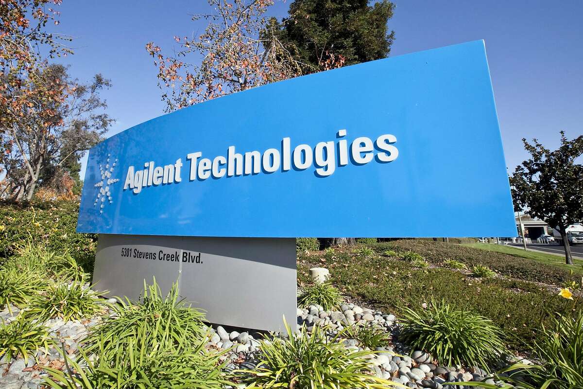 Signage is photographed outside the headquarters of Agilent Technologies Inc. prior to a dedication ceremony for a SunPower Corp. solar panel array atop Agilent's headquarters in Santa Clara, California, U.S., on Thursday, Nov. 19, 2009. SunPower Corp., the second-biggest U.S. supplier of solar modules, will meet its goal to reduce production costs to below $1 per watt by 2014, the company said last month. Photographer: Chip Chipman/Bloomberg