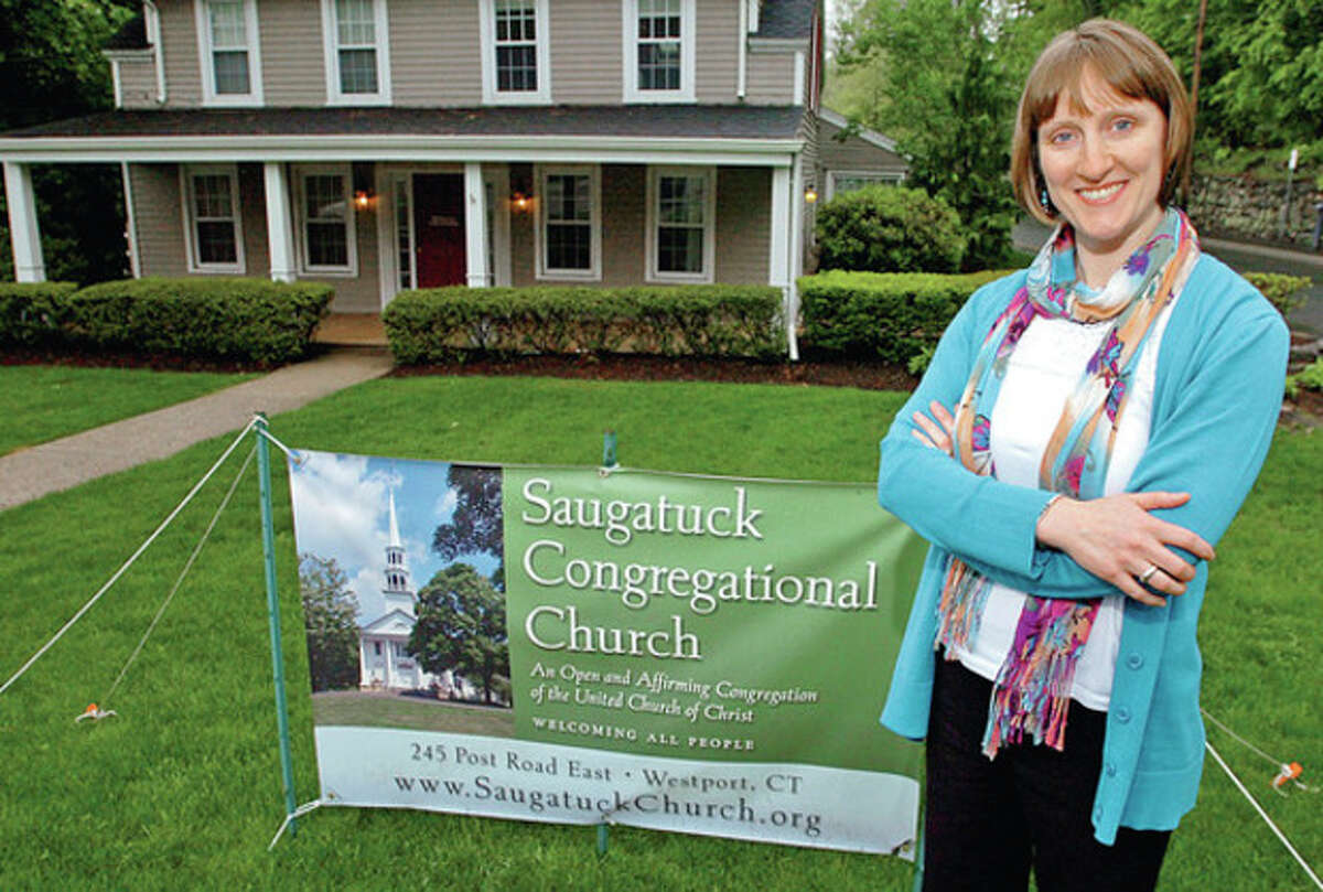 Hour photo / Erik Trautmann Alison Buttrick Patton, the new pastor at the Saugatuck Congregational Church in Westport, at their temporary offices at 319 Post Road East. The Saugatuck Congregational Church was severely damaged by fire last year.