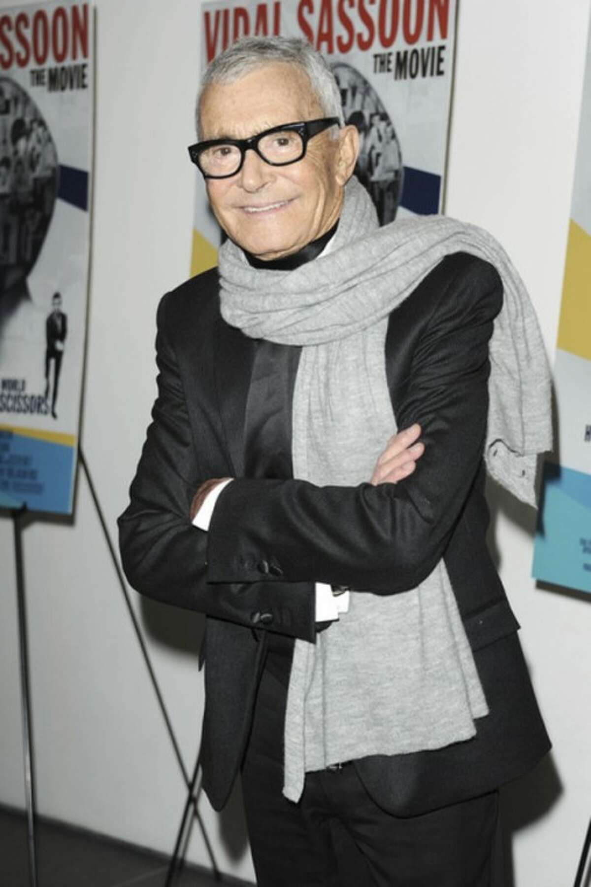 In this Feb. 9, 2011 file photo released by Starpix, hair designer and businessman, Vidal Sassoon, stops for a photo at a special screening of "Vidal Sassoon: The Movie," in New York. Sassoon, whose 1960s wash-and-wear cuts freed women from endless teasing and hairspray died Wednesday, May 9, 2012, at his home. He was 84. (AP Photo/Starpix, Dave Allocca)