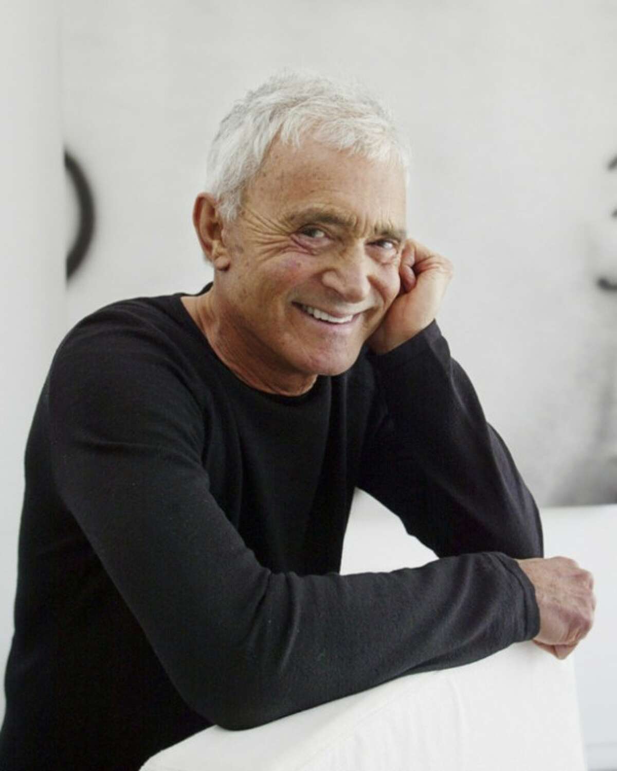 FILE - In this April 23, 2003 file photo, Vidal Sassoon poses in his Beverly Hills, Calif., home. Sassoon, whose 1960s wash-and-wear cuts freed women from endless teasing and hairspray died Wednesday, May 9, 2012, at his home. He was 84. (AP Photo/Damian Dovarganes, file)