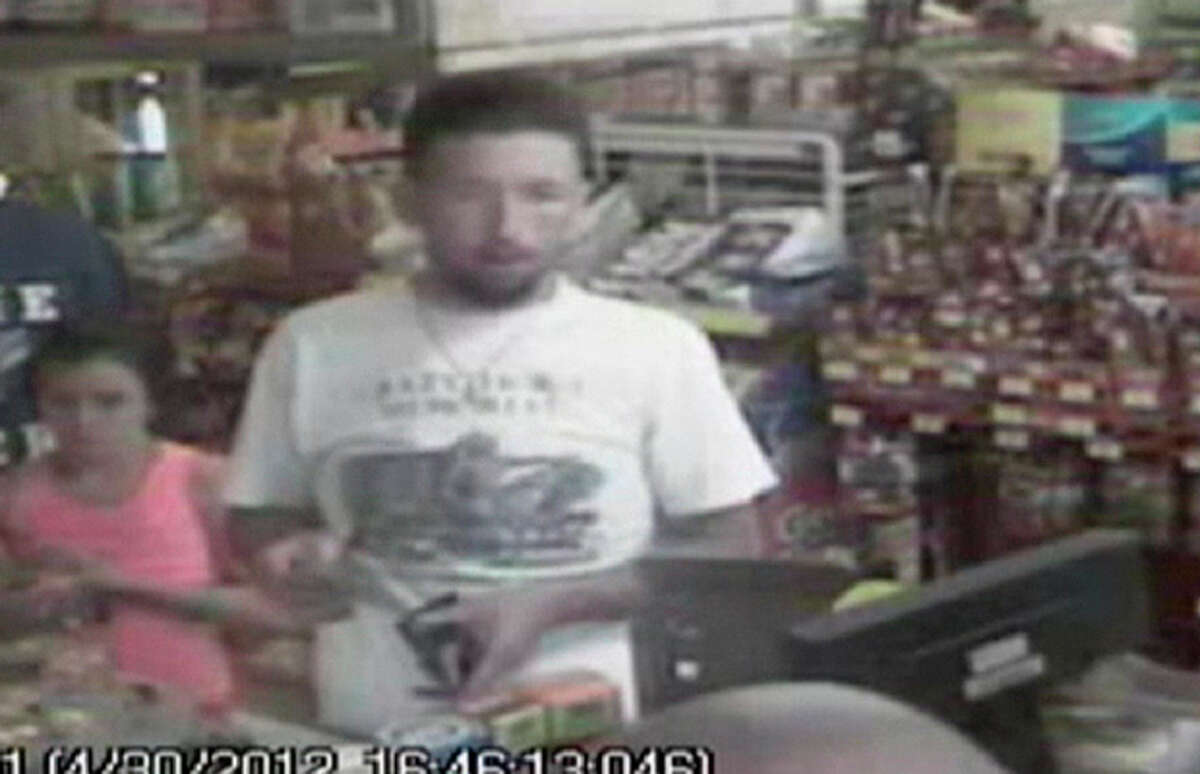 In this photo made from surveillance video and released by the Tennessee Bureau of Investigation, Adam Mayes, 35, stands in front of the counter at a convenience store on April 30, 2012 in Union County, Miss., about three days after Jo Ann Bain and her daughters disappeared. Authorities say Mayes abducted Bain and her three daughters. Bain and her oldest daughter were found dead. The two younger girls are still missing. (AP Photo/Tennessee Bureau of Investigation)
