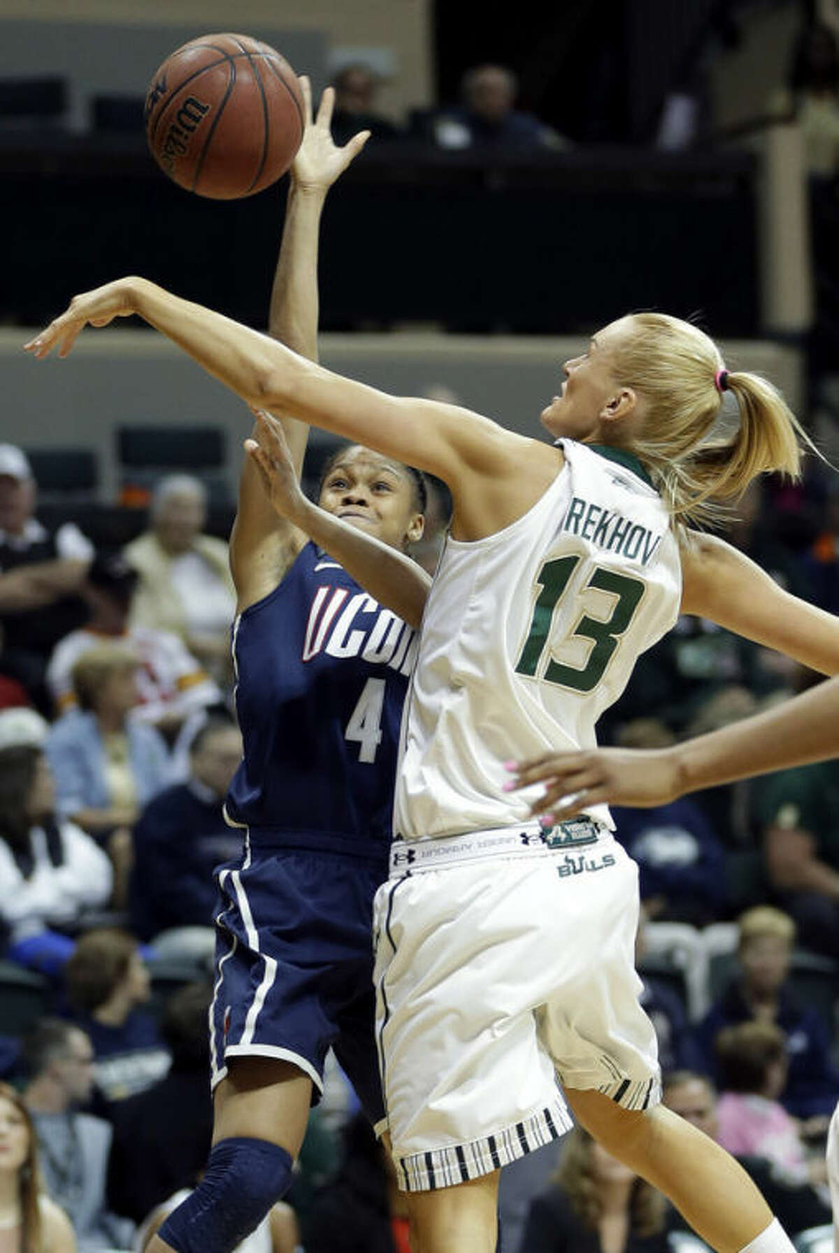 South Florida guard Inga Orekhova (13) blocks a shot by Connecticut guard Moriah Jefferson (4) during the first half of an NCAA college basketball game, Saturday, March 2, 2013, in Tampa, Fla. (AP Photo/Chris O'Meara)