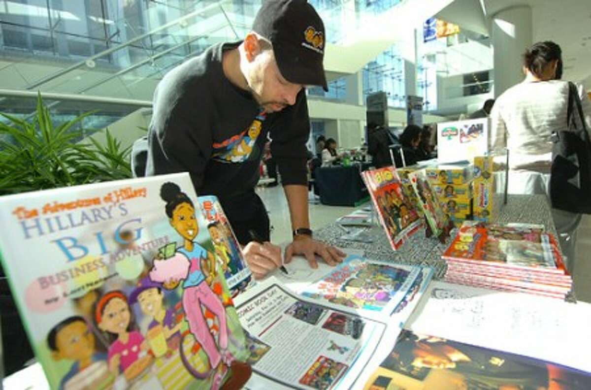 Photo/Alex von Kleydorff. Jerry Craft , Mama''s Boyz Cartoonist and Childrens books author draws one of his characters during UCONN''s community expo celebrating Black History Month.