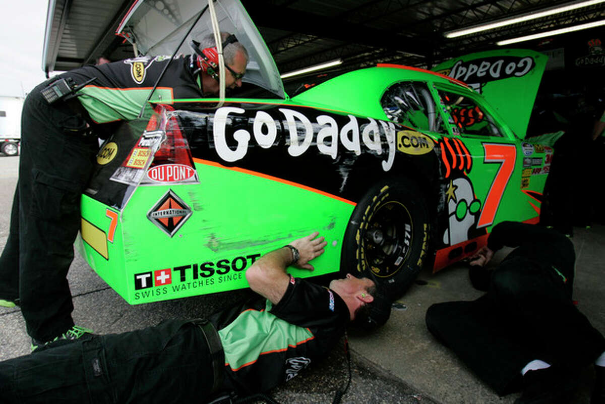 The crew for NASCAR driver Danica Patrick make adjustments to her car during practice for the Nationwide Series auto race, Friday, May 11, 2012 in Darlington, S.C. (AP Photo/Mary Ann Chastain)