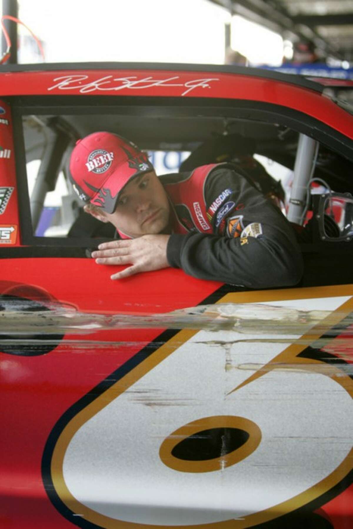 NASCAR driver Ricky Stenhouse Jr. climbs out of his car after hitting the wall at Darlington Raceway during practice for the Nationwide Series auto race, Friday, May 11, 2012 in Darlington, S.C. (AP Photo/Mary Ann Chastain)