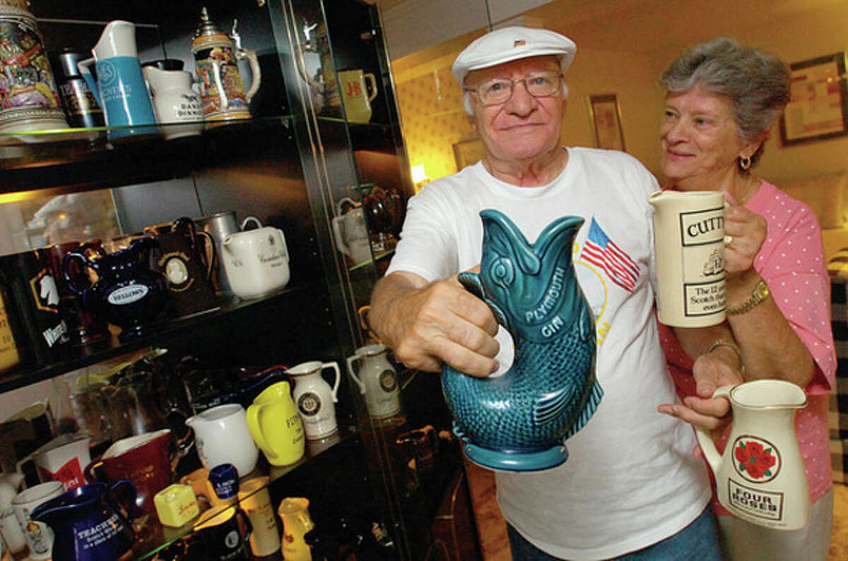 Hour photo / Erik Trautmann Mike and Marie Siano with his water pitcher collection.