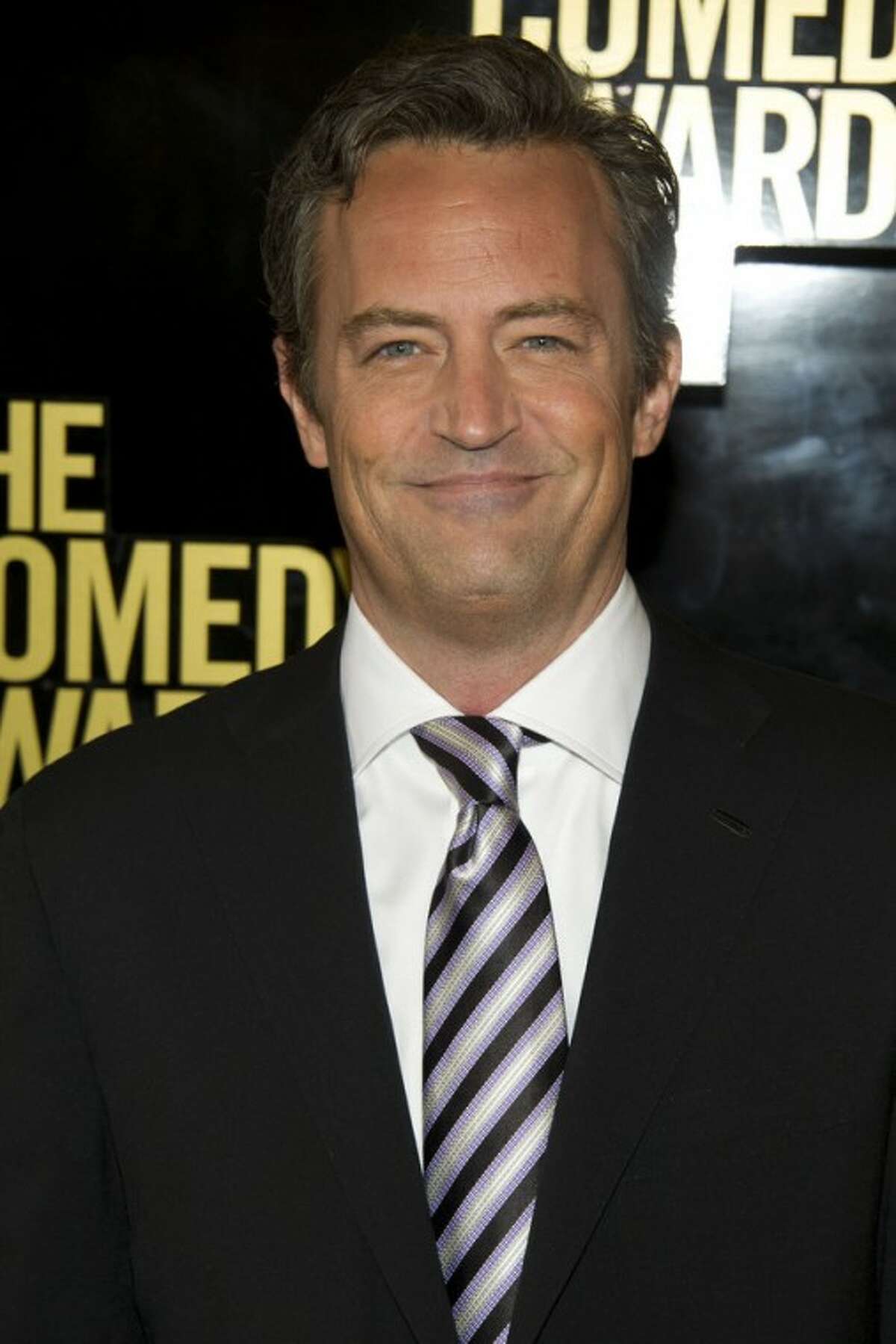 FILE - In this April 28, 2012 file photo, Matthew Perry arrives to The 2012 Comedy Awards in New York. Hoping to lure viewers with laughs, struggling NBC is calling on old friend Matthew Perry to lend a hand. The TV network unveiled a fall schedule on Sunday that has 10 sitcoms, double the number of dramas it will air, including "Go On," starring Perry as a fast-talking, sarcastic sportscaster who loses his wife in a car accident. (AP Photo/Charles Sykes, File)