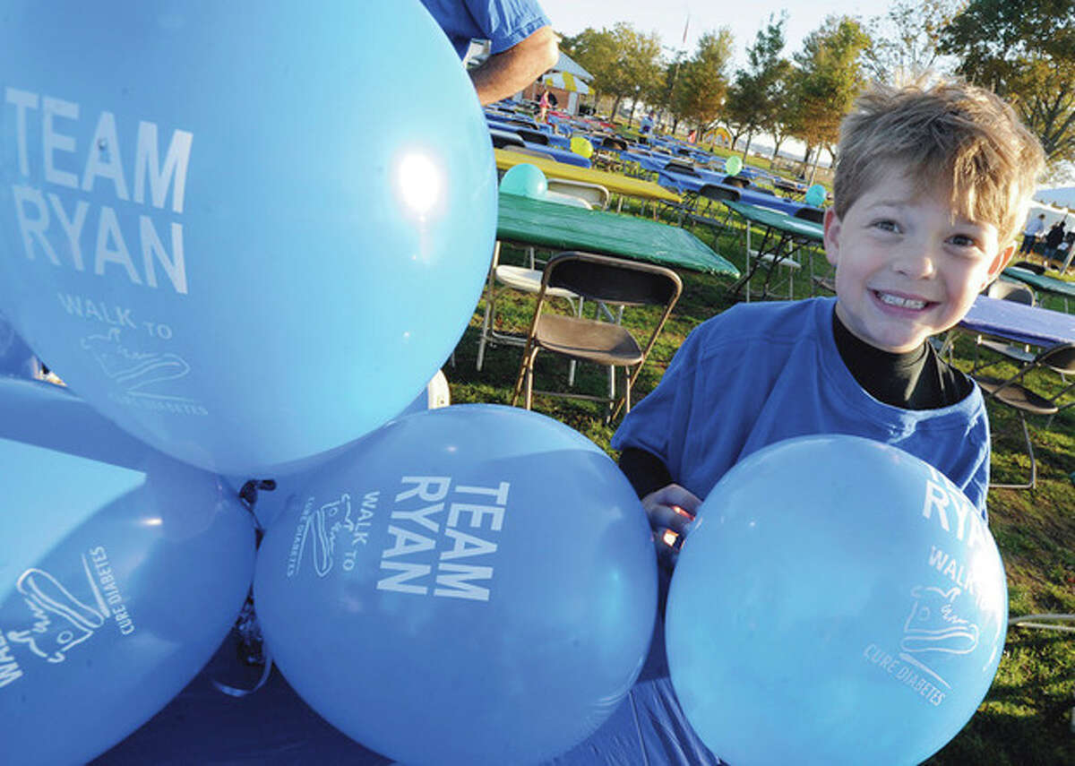 hour photo/Matthew Vinci Kevin Divico 8, with Team Ryan who has type 1 diabetes is among the many to attend the annual fall Walk to Cure Diabetes Sunday at Calf Pasture Beach.