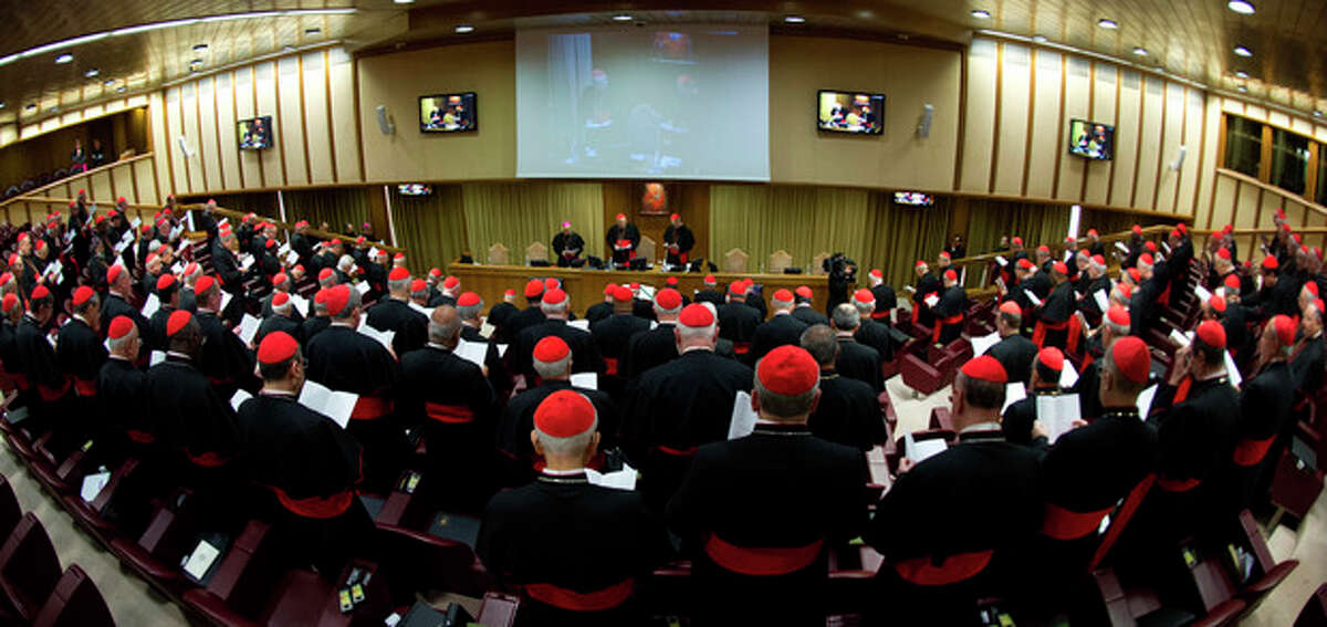 In this photo provided by the Vatican newspaper L'Osservatore Romano, cardinals attend a meeting, at the Vatican, Monday, March 4, 2013. Cardinals from around the world have gathered inside the Vatican for their first round of meetings before the conclave to elect the next pope, amid scandals inside and out of the Vatican and the continued reverberations of Benedict XVI's decision to retire. (AP Photo/L'Osservatore Romano, ho)