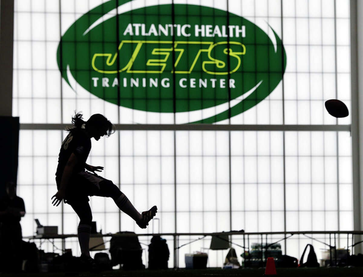 Lauren Silberman boots the ball during kicker tryouts at an NFL football regional combine workout, Sunday, March 3, 2013, at the New York Jets' training facility in Florham Park, N.J. (AP Photo/Mel Evans)