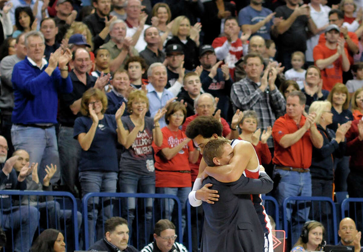 Gonzaga's Elias Harris and coach Mark Few hug as Harris exited the court in his last home game appearance in the second half of an NCAA college basketball game against Portland, Saturday, March 2, 2013, in Spokane, Wash. Gonzaga defeated Portland 81-52. (AP Photo/Jed Conklin)