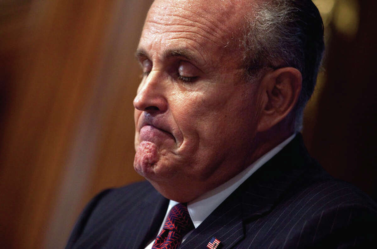 Former New York Mayor Rudy Giuliani pauses during a speech at the National Press Club on Tuesday, Sept. 6, 2011, in Washington. (AP Photo/Evan Vucci)