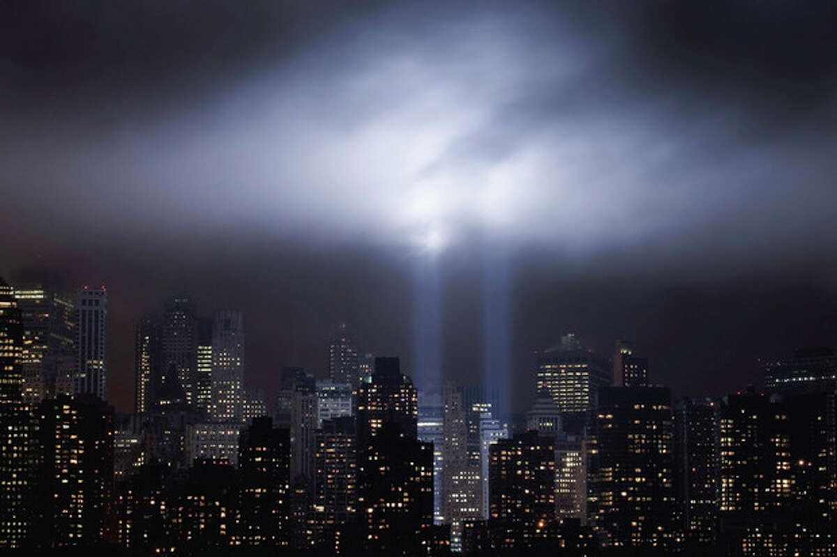 A test of the Tribute in Light rises above lower Manhattan, Tuesday, Sept. 6, 2011 in New York. The memorial, sponsored by the Municipal Art Society, will light the sky on the evening of Sept. 11, 2011 in honor of those who died ten years before in the terror attacks on the United States. (AP Photo/Mark Lennihan)