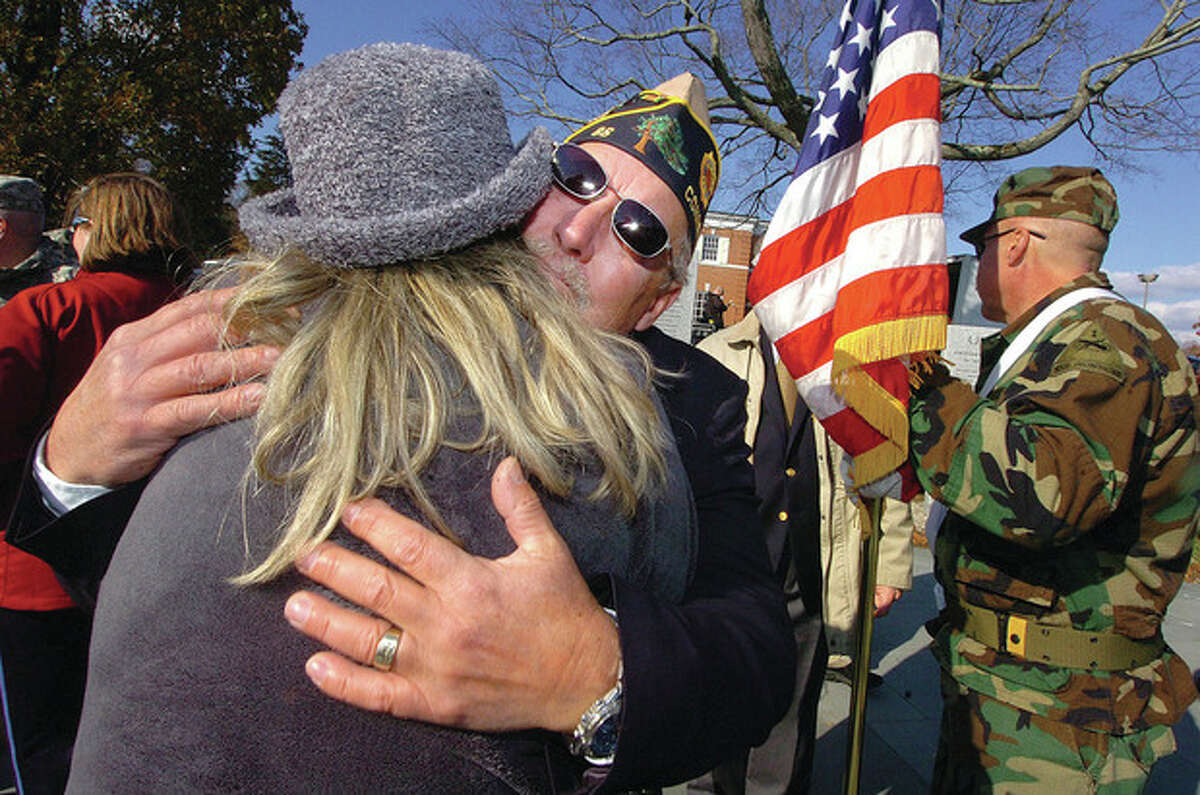 Hour Photo/ Alex von Kleydorff. Don Hazzard, Commander, Post 86 American Legion , Wilton, hugs his wife Charmaine after an emotional Veterans Day program in Wilton.