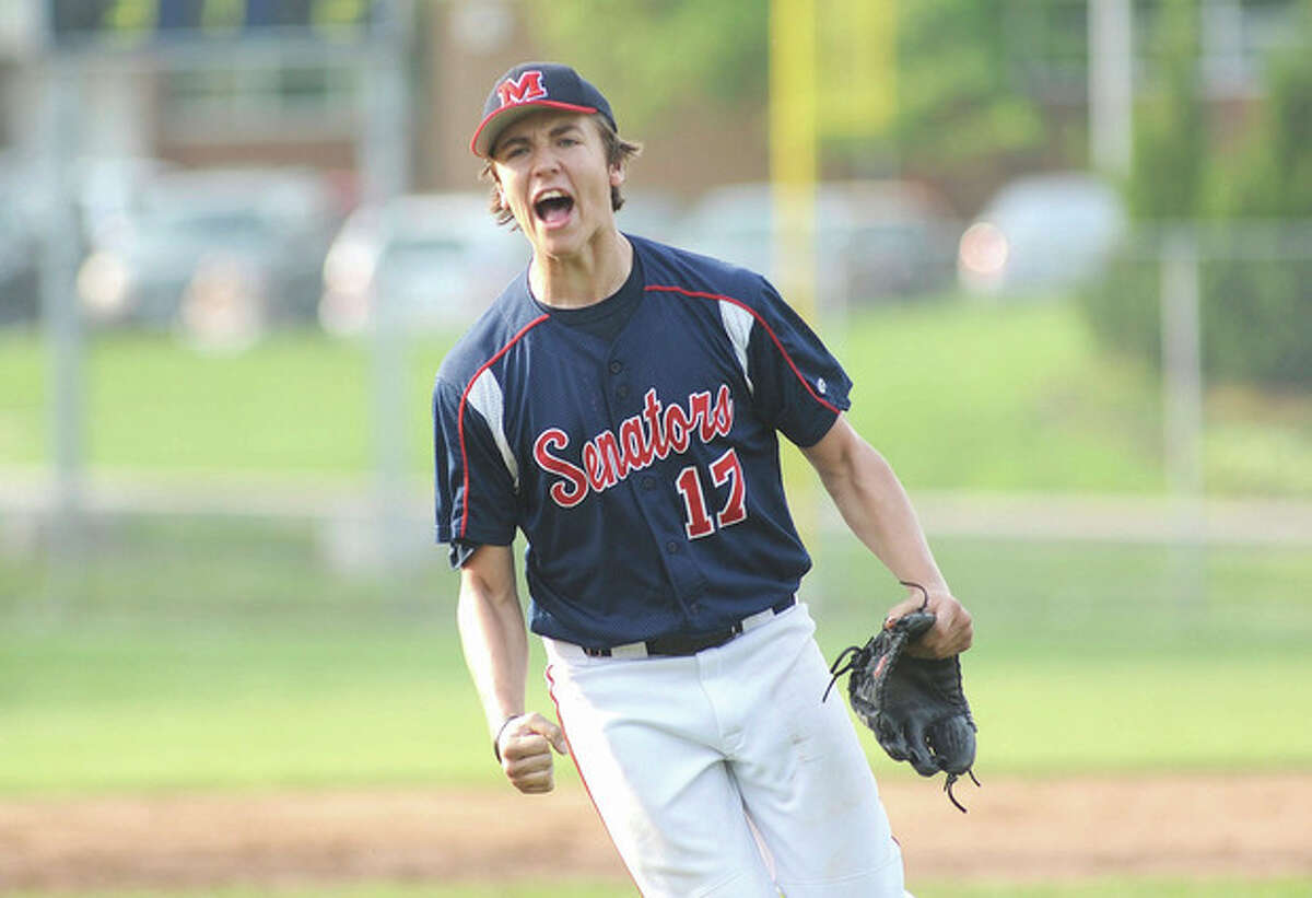 Hour photo/John Nash Brien McMahon freshman Paul Salata lets out a yell as he leaves the mound after shutting the door on Staples Wednesday afernoon. Salata made his varsity debut in the seventh inning and got the save in the Senators' 3-2 victory.
