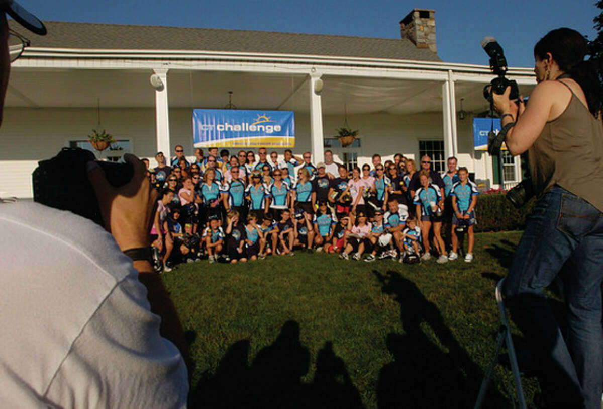 Groups pose for photographs at The 2011 Connecticut Challenge Bike Ride at Fairfield County Hunt Club in Westport Saturday.