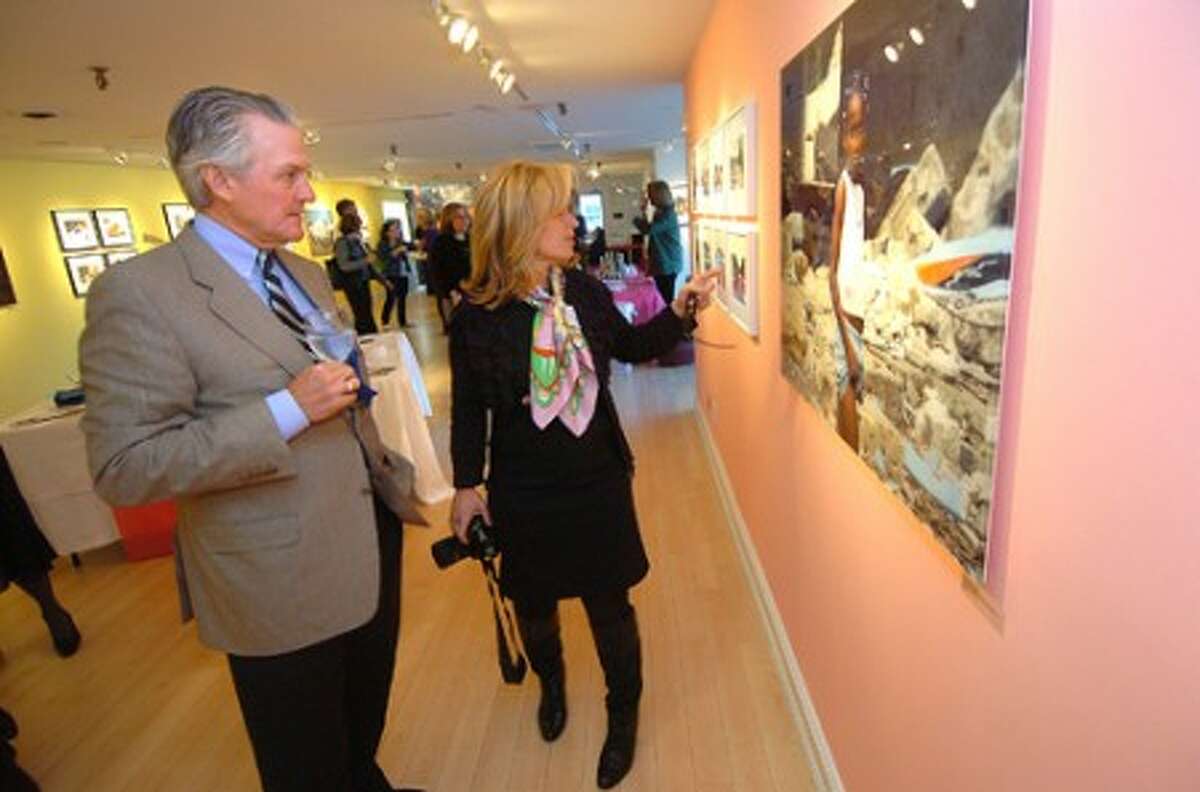 Photo/Alex von Kleydorff. AmeriCares CEO Curt Welling and ''Hope in Haiti'' Curator Helen Klisser During talk about the images from Haiti at the opening reception Thursday at The Westport Arts Center.