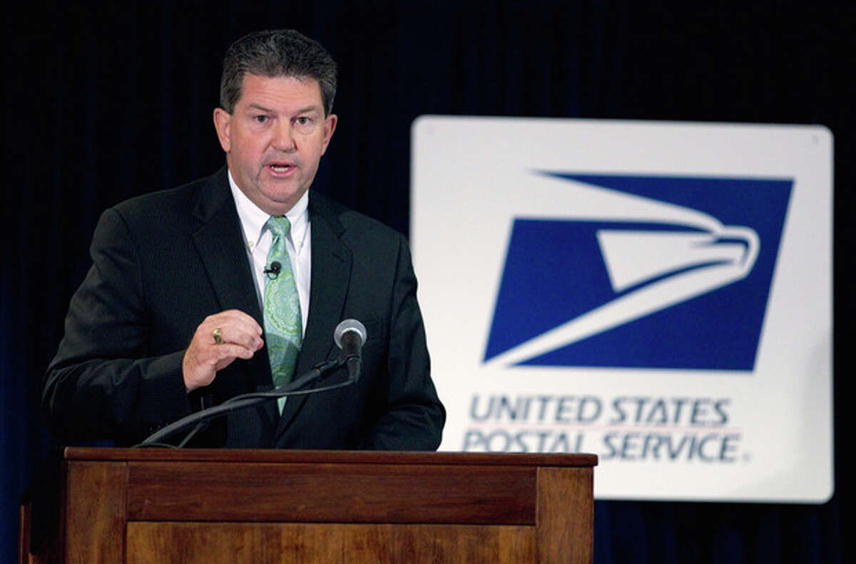 FILE - In this Sept. 15, 2011, file photo Postmaster General Patrick Donahoe speaks at a news conference on changes to the Postal Service that could potentially save as much as $3 billion in Washington. The estimated $3 billion in reductions, to be announced in broader detail on Monday, Dec. 5, 2011, are part of a wide-ranging effort by the Postal Service to quickly trim costs and avert bankruptcy. While providing short-term relief, the changes could ultimately prove counterproductive, pushing more of America's business onto the Internet.( AP Photo/Evan Vucci)