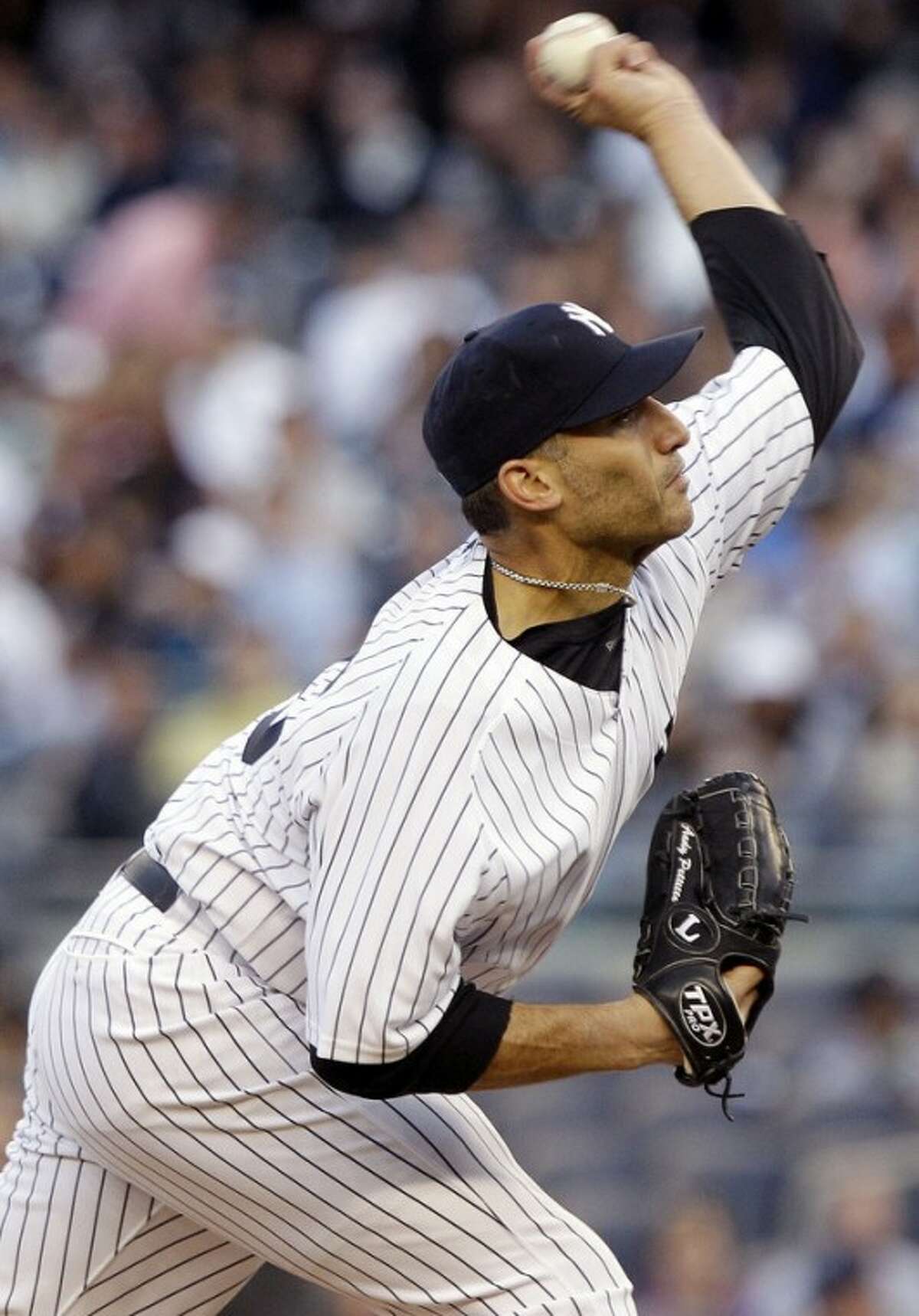 New York Yankees' Andy Pettitte delivers a pitch during the first inning of an interleague baseball game against the Cincinnati Reds, Friday, May 18, 2012, in New York. (AP Photo/Frank Franklin II)