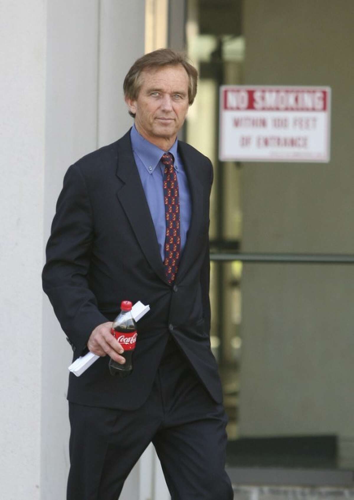 Robert F. Kennedy Jr. leaves the Westchester County Courthouse in White Plains, N.Y., on Friday, May 18, 2012, after he and members of the Mary Richardson Kennedy family met in court to decide who would get possession of his late wife's body. Mary Richardson Kennedy committed suicide by hanging herself on Wednesday, May 16, 2012. She was 52. ( AP Photo/The Journal News, Mark Vergari) NYC OUT, NO SALES, ONLINE OUT, TV OUT, NEWSDAY INTERNET OUT