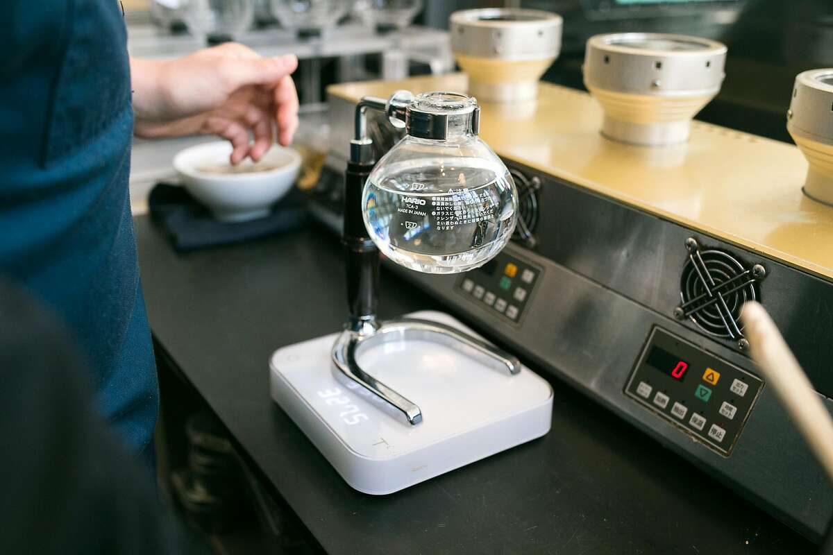 Water gets measured for a siphon cup of coffe at Blue Bottle Coffee in SOMA.