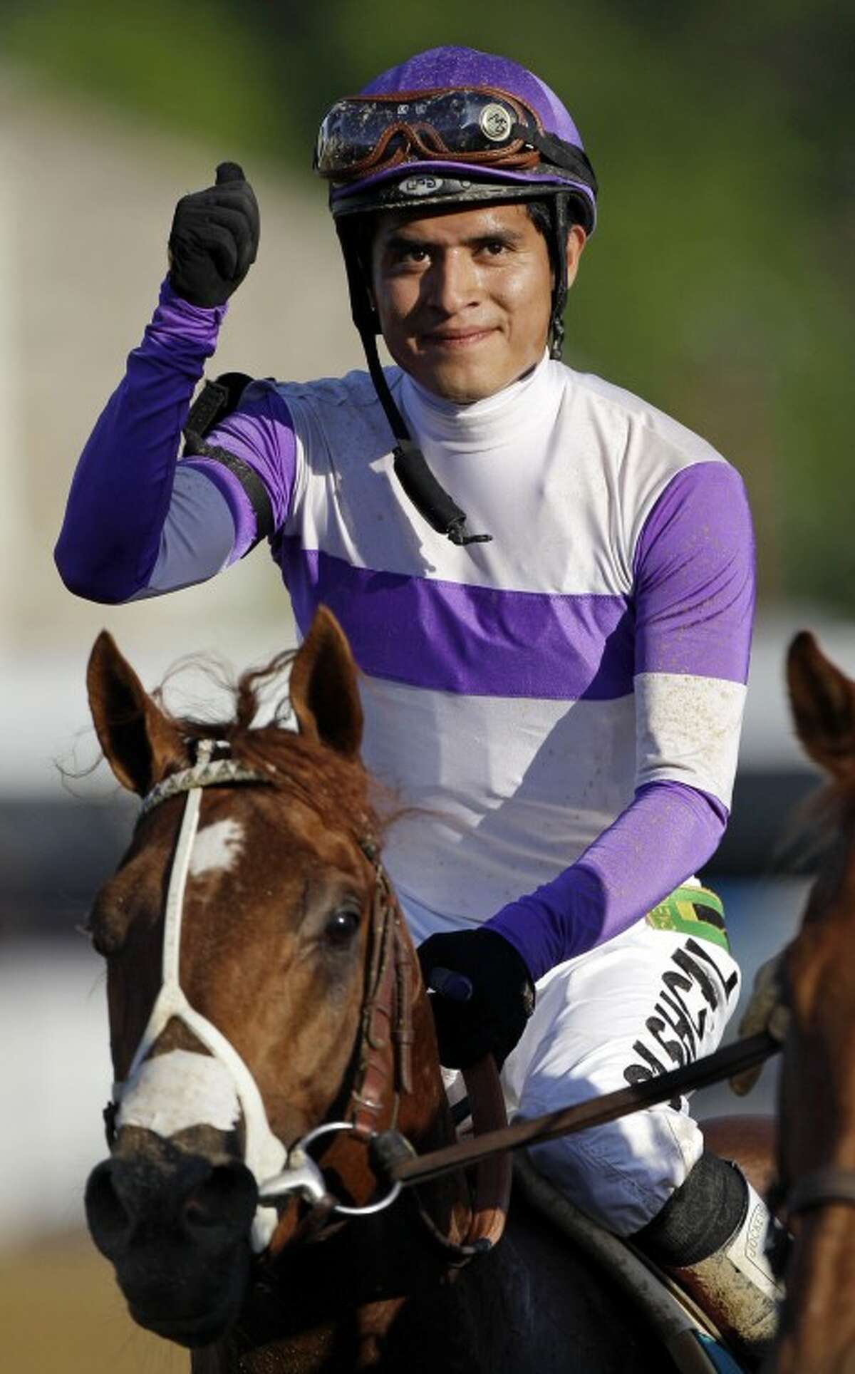 Jockey Mario Gutierrez reacts aboard I'll Have Another after winning the 137th Preakness Stakes horse race at Pimlico Race Course, Saturday, May 19, 2012, in Baltimore. (AP Photo/Patrick Semansky)