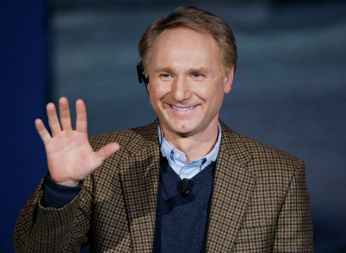 FILE - In this Dec. 6, 2009 file photo, writer Dan Brown, author of "The Da Vinci Code," waves as he appears on the Italian State RAI TV program "Che Tempo che Fa", in Milan, Italy. Brown on Friday, May 18, 2012 made a rare public appearance in Portsmouth, N.H., sharing stories about writing, movie-making, science, religion, and more. The author, who grew up in New Hampshire, spoke at a benefit for The Music Hall's "Writers on a New England Stage" series. (AP Photo/Luca Bruno)