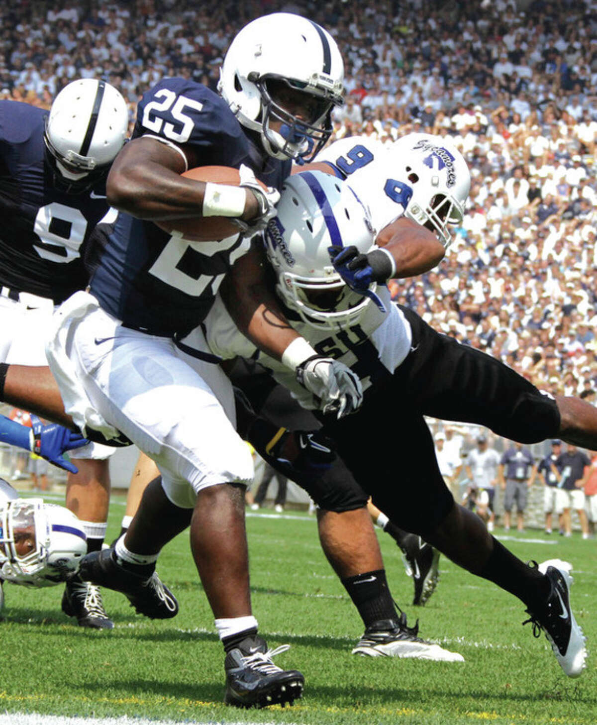 AP photo Penn State running back Silas Redd gets into the end zone for a touchdown past Indiana State defender Julian Easterly (6) during the first quarter of Saturday's game. A Norwalk resident, Redd ran for 104 yards and two TDs in Penn State's 41-7 win.