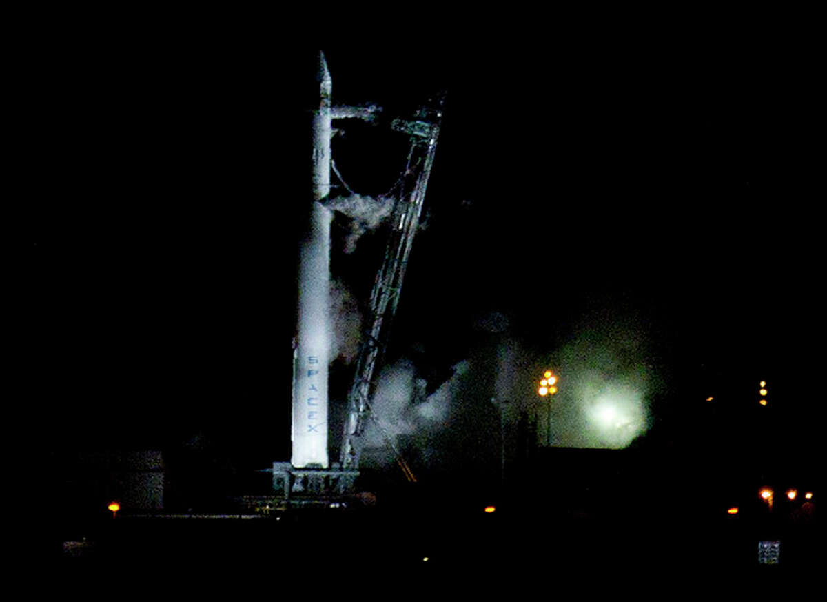 The Falcon 9 SpaceX rocket sits on the launch pad at complex 40 moments after the launch was aborted due to technical problems at the Cape Canaveral Air Force Station in Cape Canaveral, Fla., early Saturday, May 19, 2012.(AP Photo/John Raoux)