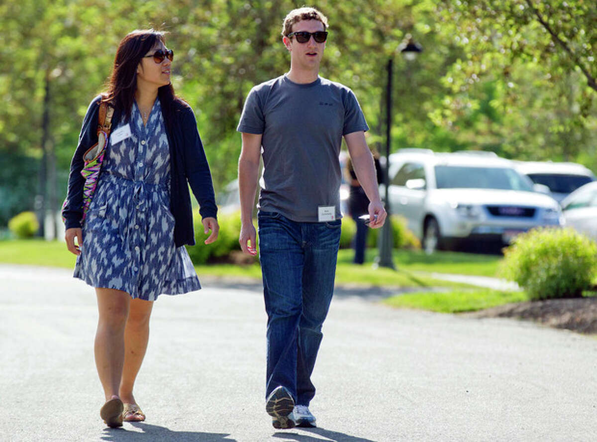 FILE- In this July 9, 2011, file photo, Mark Zuckerberg, president and CEO of Facebook, walks to morning sessions with his girlfriend Priscilla Chan during the 2011 Allen and Co. Sun Valley Conference, in Sun Valley, Idaho. On Saturday, May, 19, 2012, Zuckerberg and Chan tied the knot at a small ceremony at his Palo Alto, Calif., home, capping a busy week for the couple (AP Photo/Julie Jacobson)