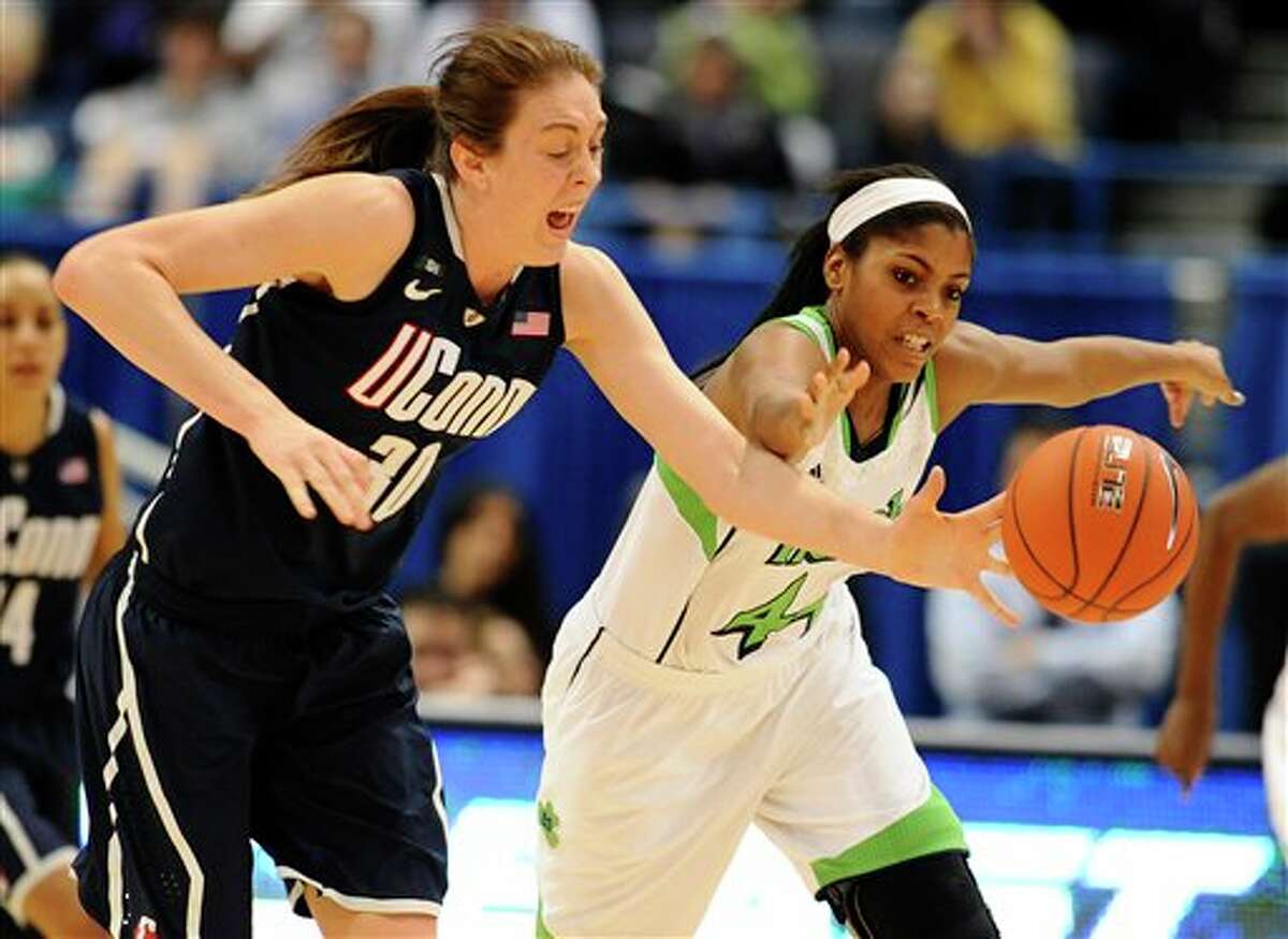 Connecticut's Breanna Stewart, left, steals the ball from Notre Dame's Ariel Braker, right, in the second half of an NCAA college basketball game in the final of the Big East Conference women's tournament in Hartford, Conn., Tuesday, March 12, 2013. (AP Photo/Jessica Hill)