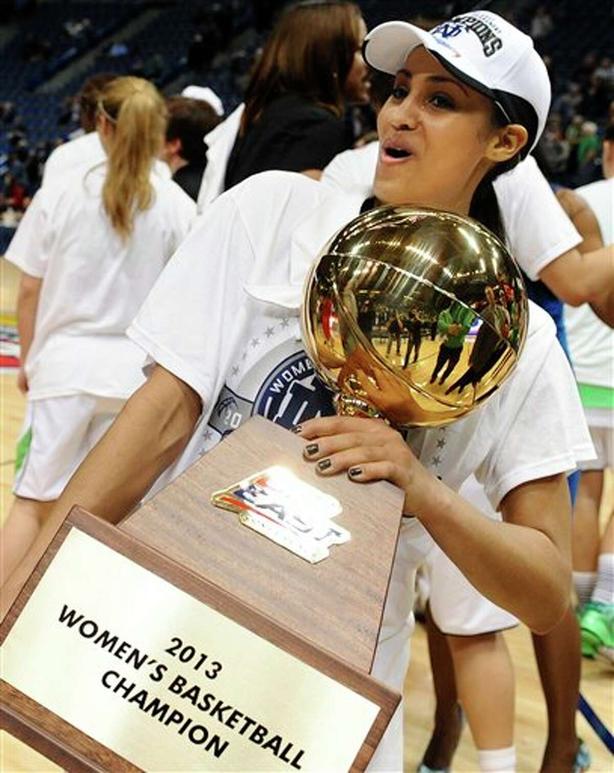 Notre Dame's Skylar Diggins holds up the Big East Conference women's tournament championship trophy after their 61-59 win over Connecticut in an NCAA college basketball game in Hartford, Conn., Tuesday, March 12, 2013. (AP Photo/Jessica Hill)