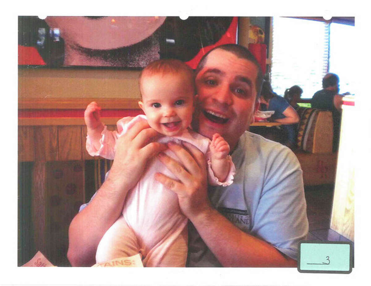 FILE - This undated file photo submitted into evidence by defense attorney Julia L. Gatto shows New York City police Officer Gilberto Valle with his daughter. Valle, accused of plotting to kidnap, cook and eat women _ including his wife _ was convicted of conspiracy Monday, March 12, 2013. (AP Photo/Provided by Attorney Julia L. Gatto, File)