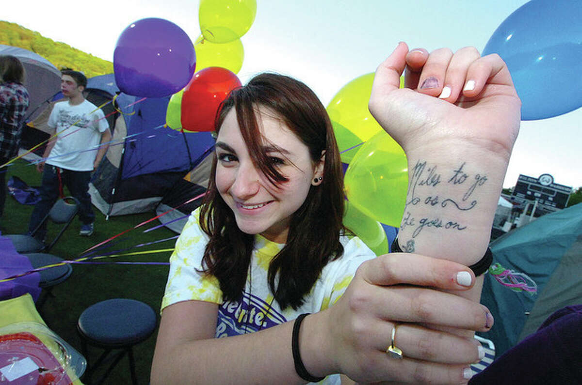 Hour Photo/ Alex von Kleydorff. Team Captain Sam Walsh shows the tatto on her wrist for her team 'Miles to Go' during Wiltons Relay for life