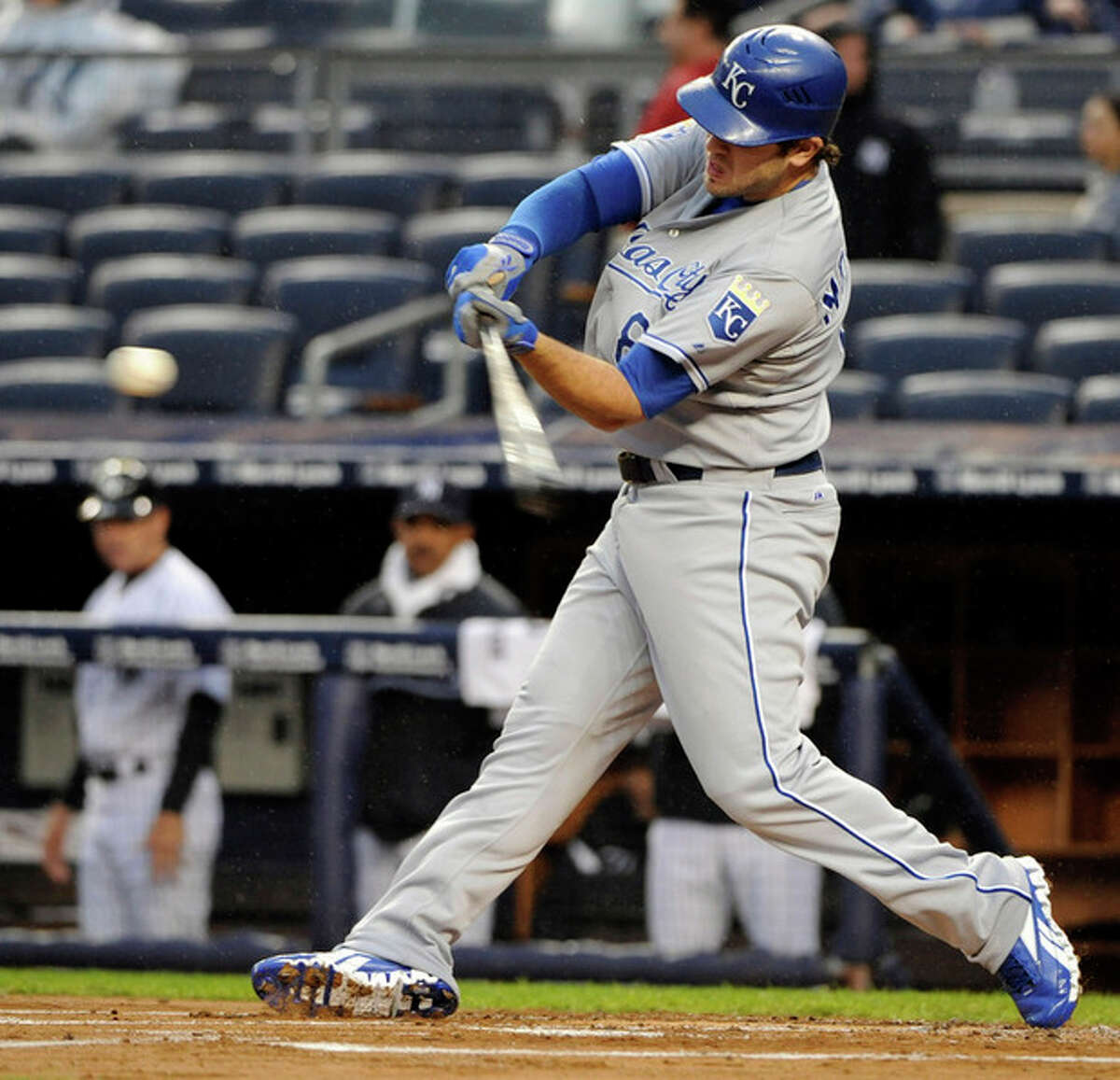 Kansas City Royals' Mike Moustakas hits a two-run home run during the first inning of a baseball game against the New York Yankees, Monday, May 21, 2012, at Yankee Stadium in New York. (AP Photo/Bill Kostroun)