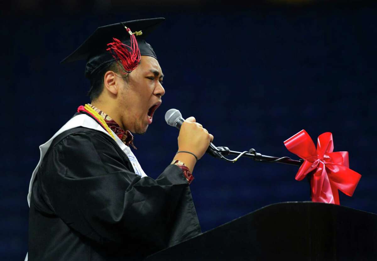 Graduate and Senior Class President Patrick Setiadi lets out a huge cheer before his address during Central High School's Class of 2016 Graduation Exercises at the Webster Bank Arena in Bridgeport, Conn., on Tuesday June 14, 2016.
