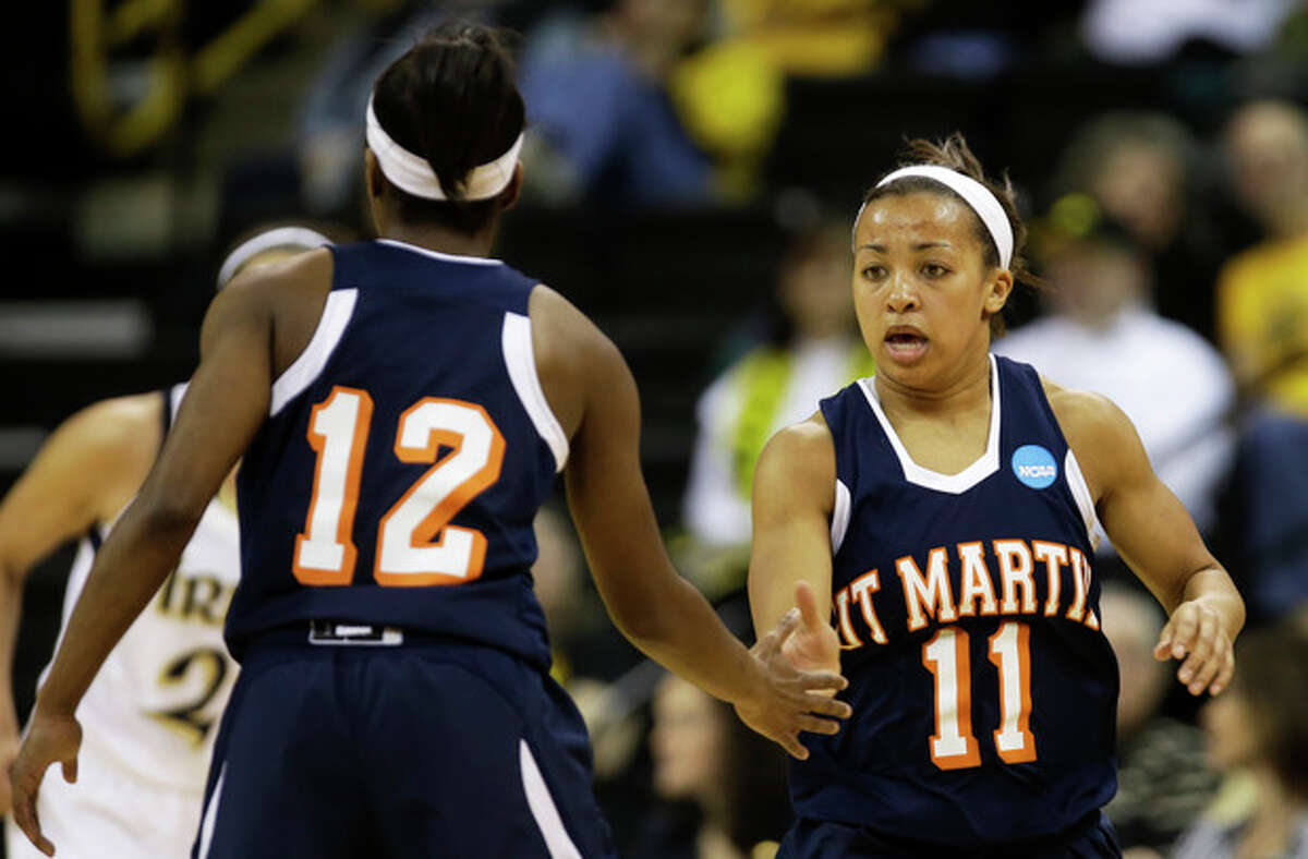 Tennessee Martin guard Heather Butler, right, reacts with teammate Jasmine Newsome, left, after making a three-point basket during the first half of a first-round game against Notre Dame in the women's NCAA college basketball tournament on Sunday, March 24, 2013, in Iowa City, Iowa. (AP Photo/Charlie Neibergall)