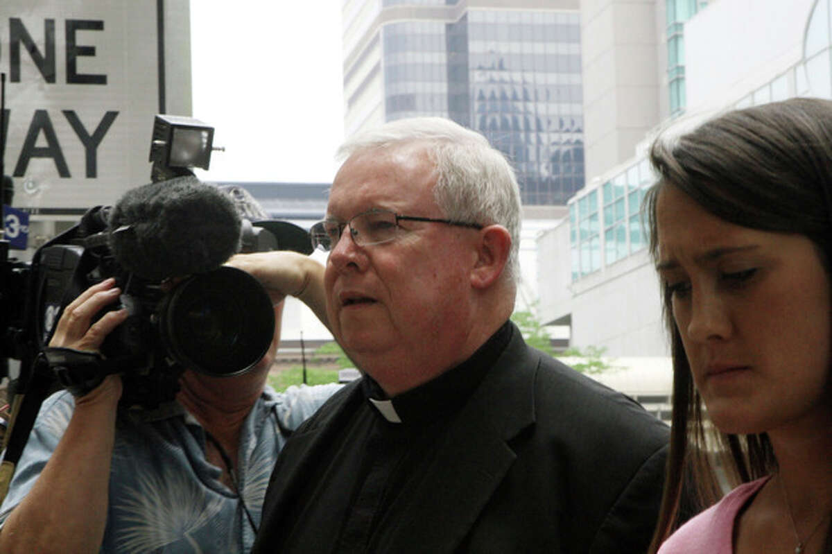 Monsignor William Lynn walks to the Criminal Justice Center before a scheduled verdict reading, Friday, June 22, 2012, in Philadelphia. Lynn is the first U.S. church official charged for allegedly helping an archdiocese cover up abuse claims. He faces about 10 to 20 years in prison if convicted of conspiracy and two counts of child endangerment. (AP Photo/Brynn Anderson)