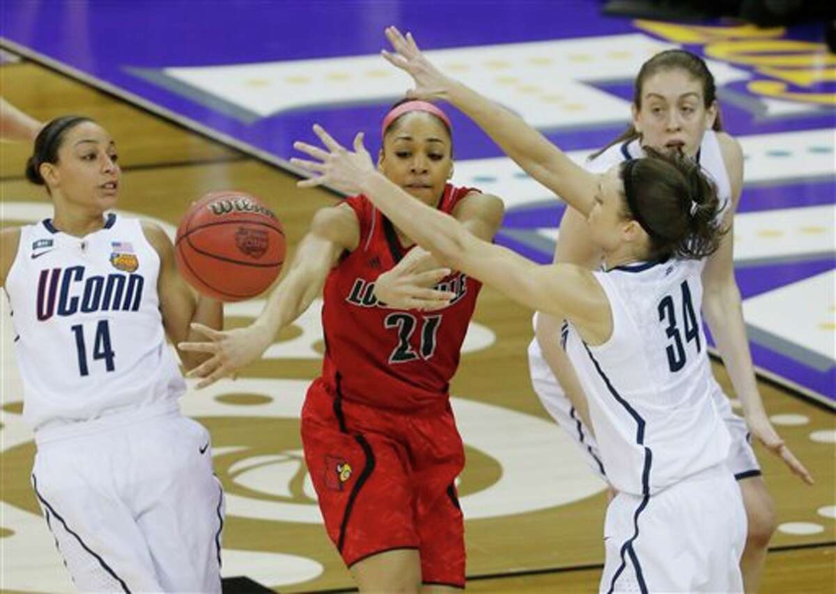 Louisville guard Bria Smith (21) passes the ball against Connecticut guard Kelly Faris (34) during first half of the national championship game of the women's Final Four of the NCAA college basketball tournament, Tuesday, April 9, 2013, in New Orleans. (AP Photo/Bill Haber)