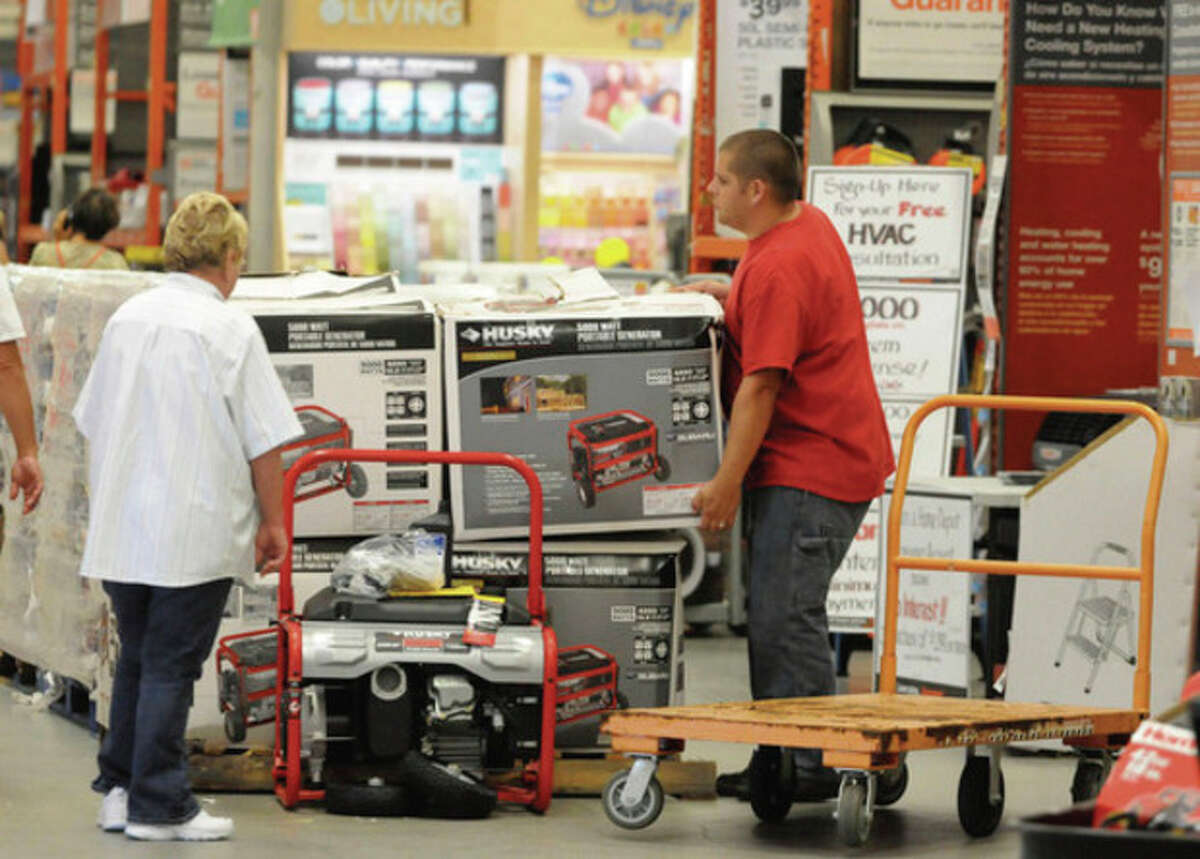 Customer Joe Outten selects a generator as area residents stock up on supplies at Home Depot in preparation for Hurricane Irene Wednesday Aug. 24, 2011 in Wilmington, N.C. Hurricane Irene strengthened to a major Category 3 storm over the Bahamas on Wednesday with the East Coast in its sights. (AP Photo/Star-News, Paul Stephen) NO SALES, NO MAGS, INTERNET OUT